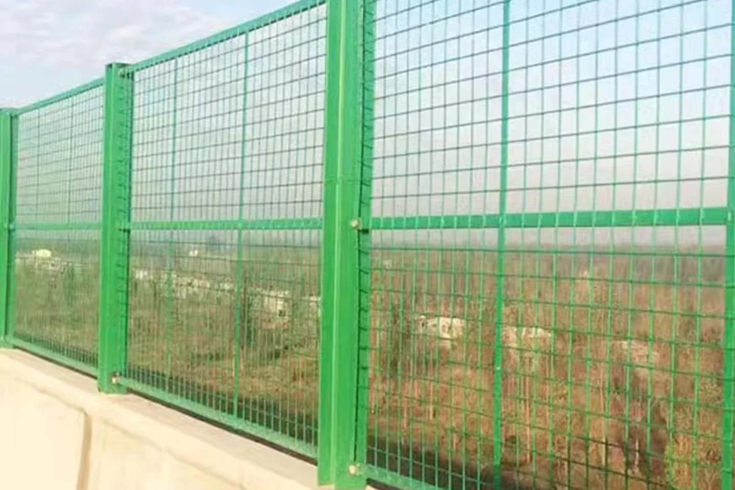 Green framed welded mesh bridge screen panel