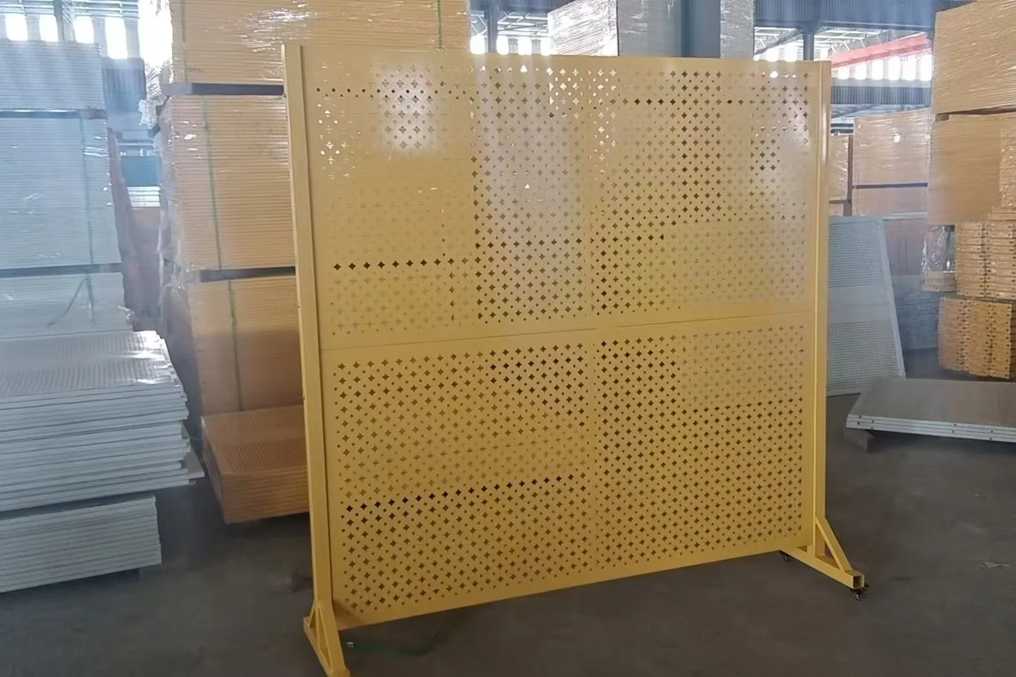 Yellow mobile perforated panel with broad support feet